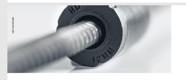 Macro detail of an HD12 OneTouch Coupler engaged on reinforcing bar